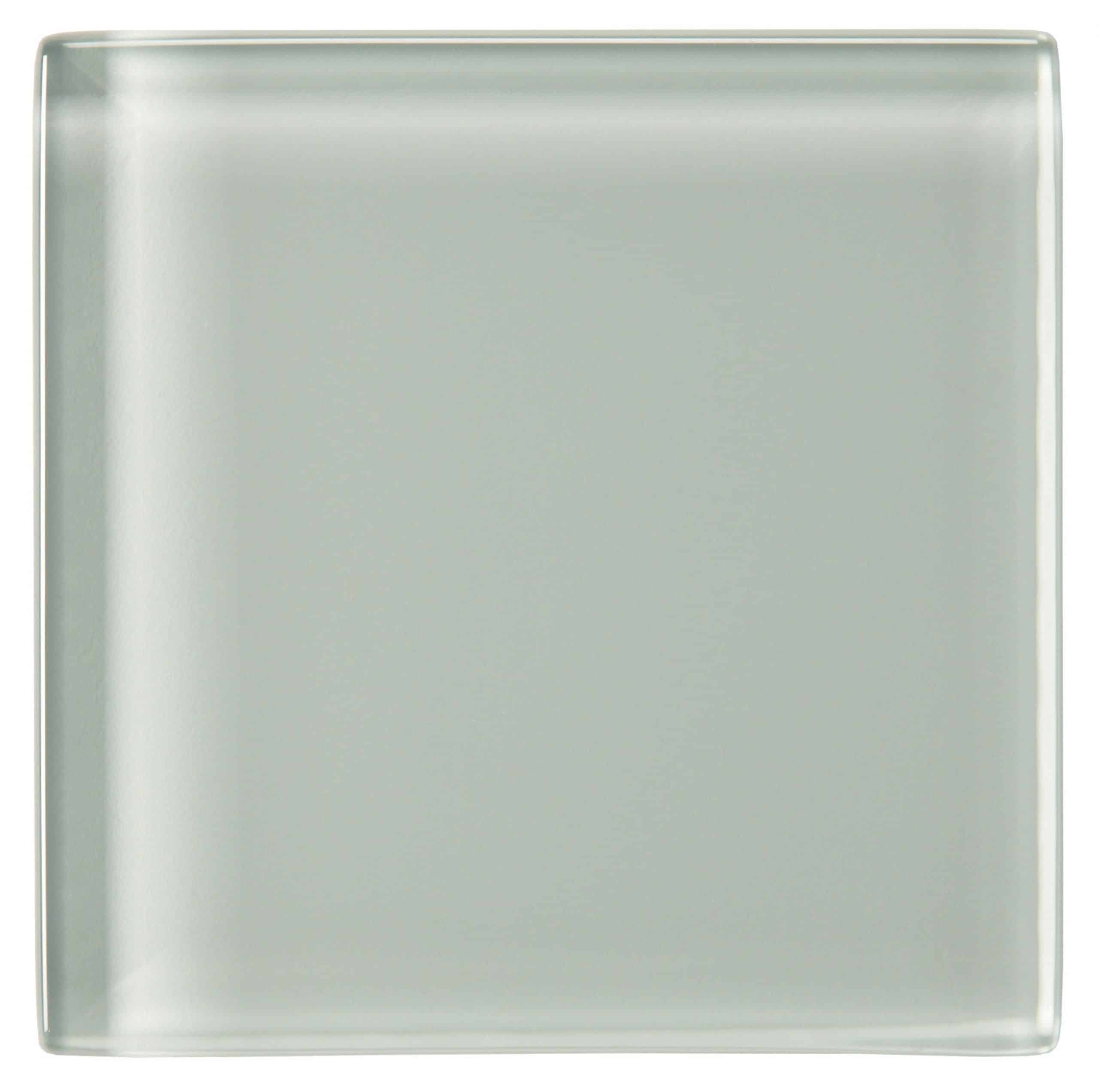 A close-up view of a natural stone tile with a textured surface and a grayish hue.