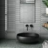Rockingham Grey tile - A close-up view of a grey stone tile with a textured surface