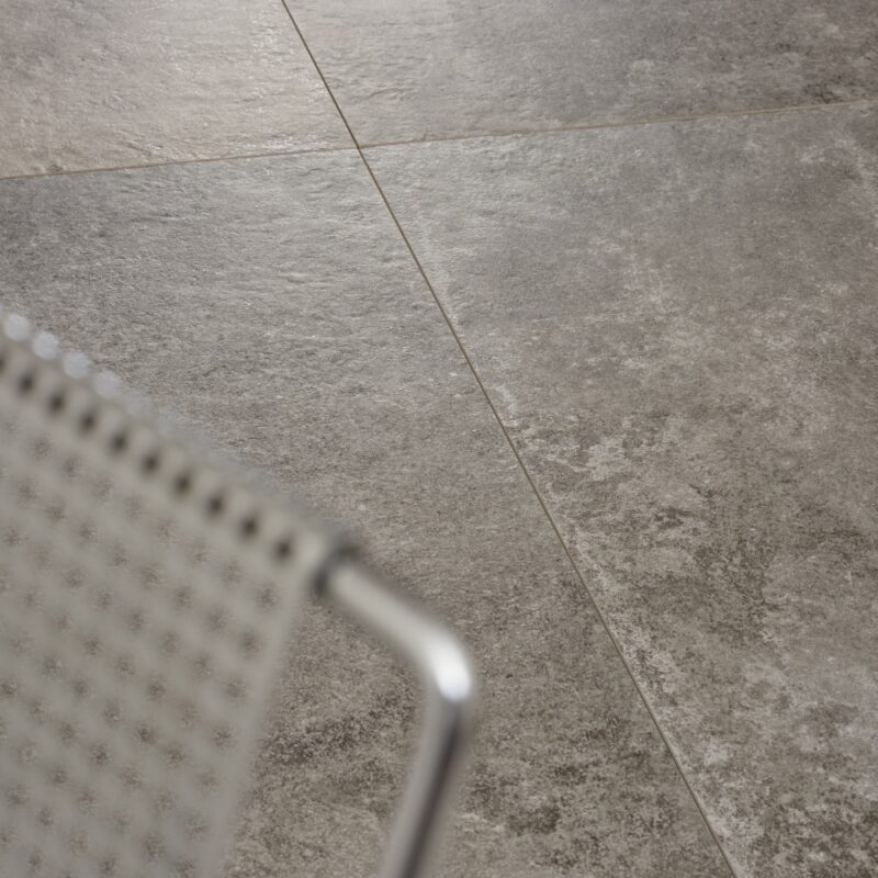 Close-up view of Taurus Grey tile showcasing its elegant texture and color variation.