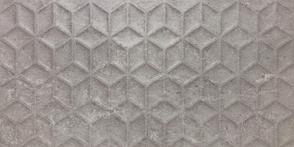 A close-up view of a beautiful tile pattern in shades of cream and gray on a bathroom wall, adding elegance and style to the space.