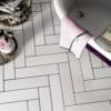 Image of Wareham White Plume tile - a beautiful white textured tile with slight variations and a feather-like pattern.