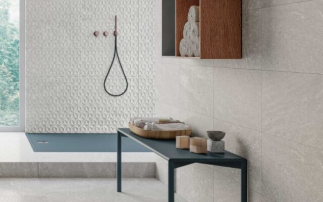 Alternating pattern of gray and white rectangular tiles in a bathroom design